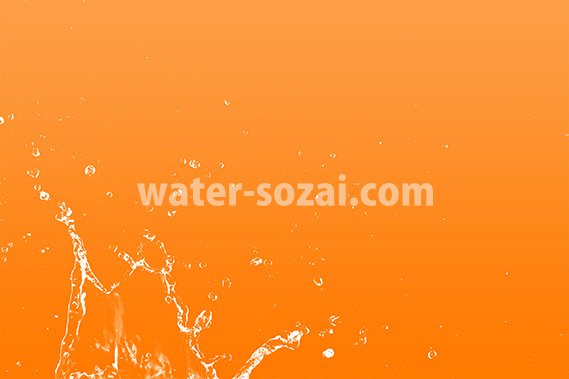 オレンジ色背景の水飛沫が上がる写真・フォト