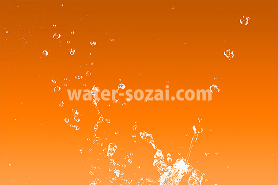 オレンジ色背景の水が散布する写真・フォト